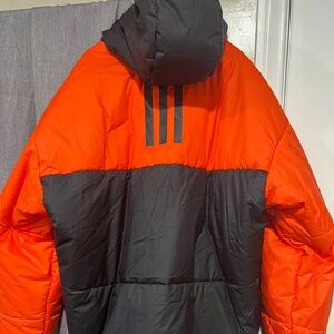 Adidas puffer new with tag XL for men.